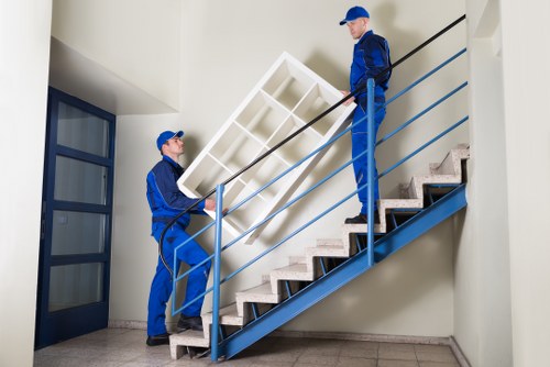 Removalist truck loading household furniture in Kingston
