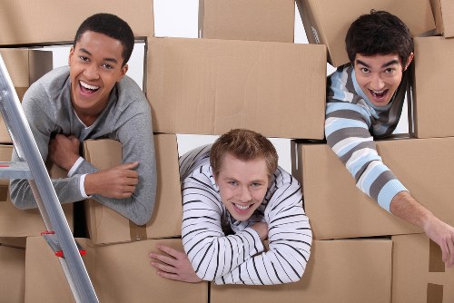 Removal staff handling furniture during a Kingston home move