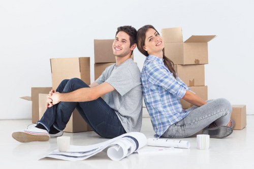Local movers carrying furniture from a Kingston property