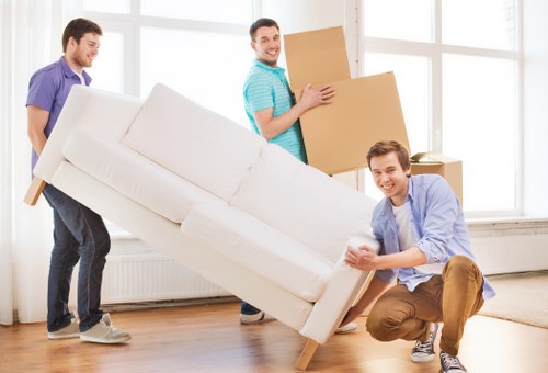 Office relocation with desks and equipment being moved in Kingston