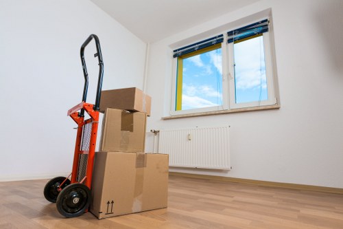 Local removals team transporting household furniture through Kingston town area