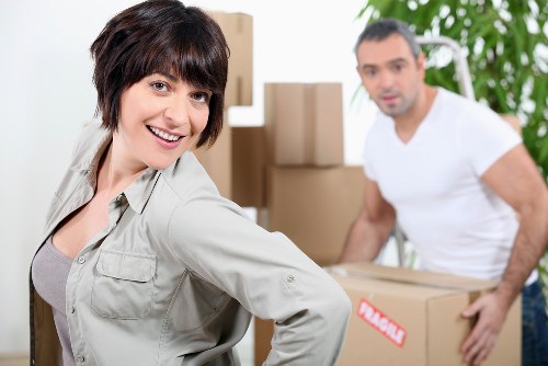 Trained movers handling household items with care