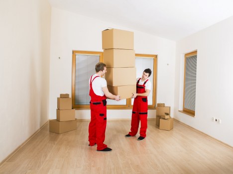 Office relocation loading service with boxes and furniture