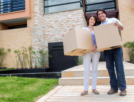 Local movers transporting furniture with a removals van in Kingston